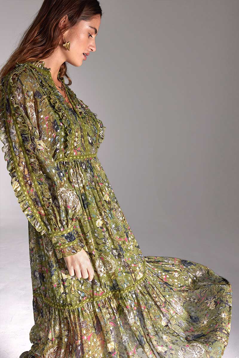 Model wears East Heritage Tahani Green printed lurex dress