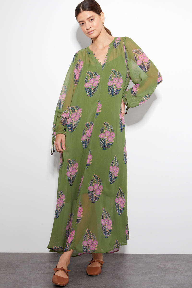 Model wears Cass  printed green viscose georgette dress by East