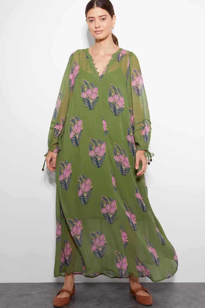 Model wears Cass  printed green viscose georgette dress by East