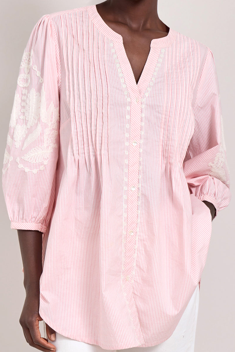 Model wears East Simran pink stripe pintuck embroidered blouse. 