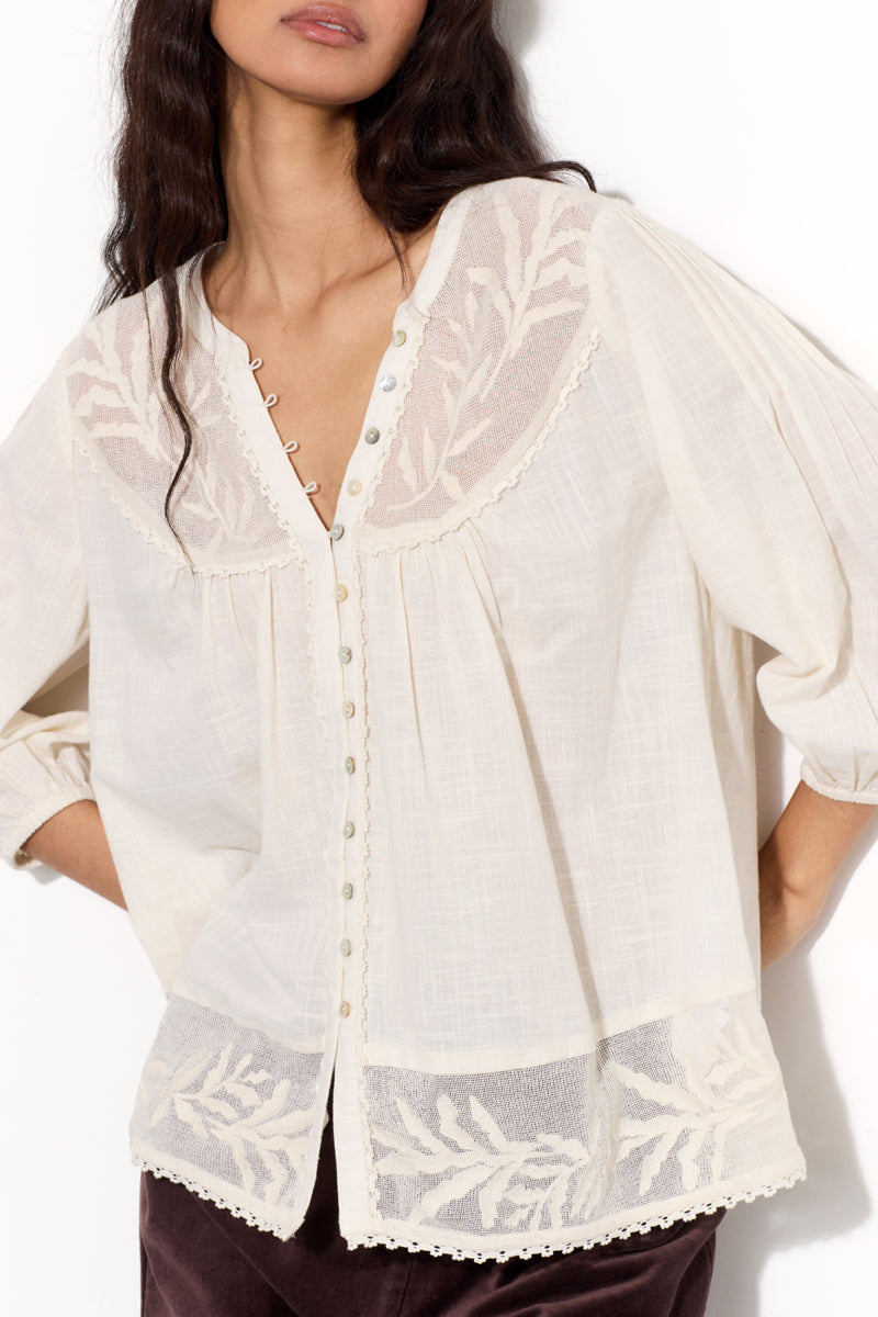 Model wears EAST Theia Ivory Embroidered Mesh Top