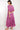 Back view of model wearing East Heritage Cornelia Fuchsia Boho Dress