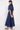 Back view of model wearing East Bennu Navy Dress