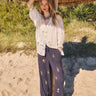 Model wears East Miranda Trousers with East Miranda Top