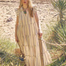 Model wears East Corrine Dress on the beach