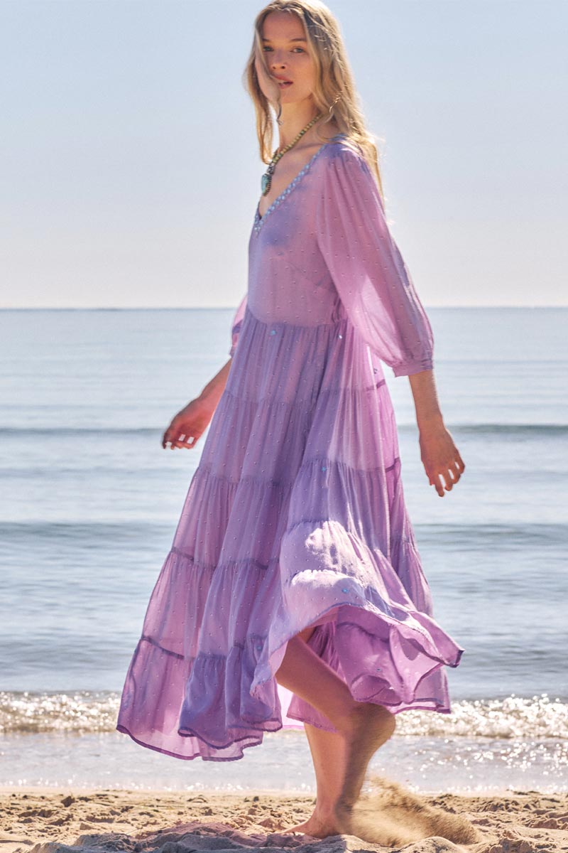 Side view of model wearing East Malia Dress on the beach