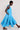 Side view of model wearing East Fleur Blue Spot Dress