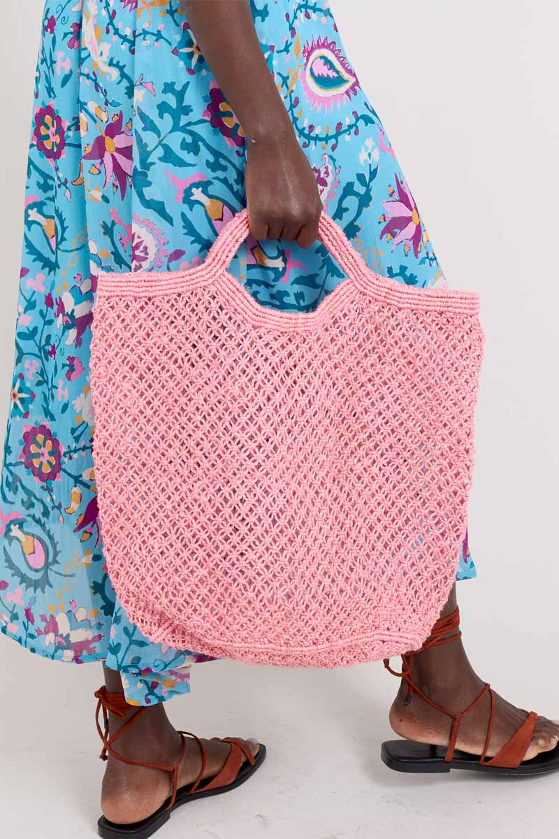 Model holding Maison Bengal Jute Pink Bag