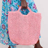 Model holding Maison Bengal Jute Pink Bag